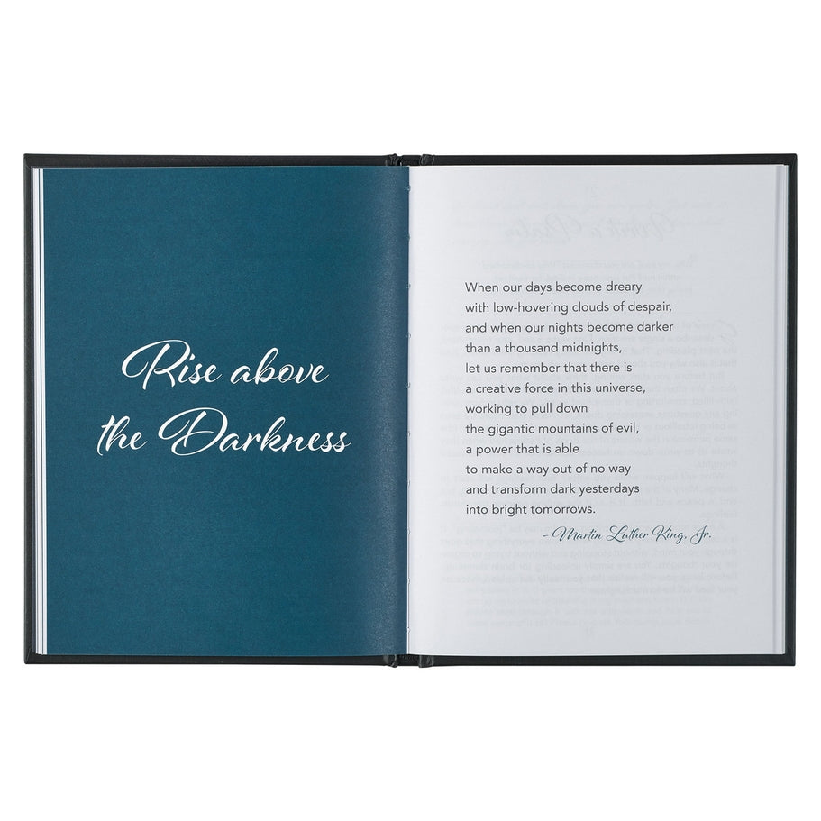 Open hardcover devotional book with a quote by Martin Luther King, Jr. on a white page.