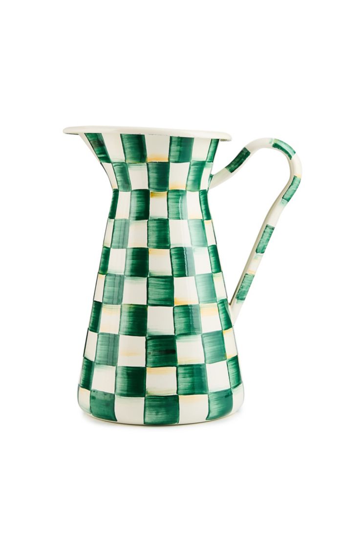 Emerald green and white hand-painted checkered enamel pitcher with a curved handle.