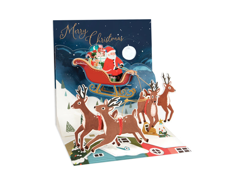 White envelope with gold foil finish featuring a Santa sleigh illustration.
