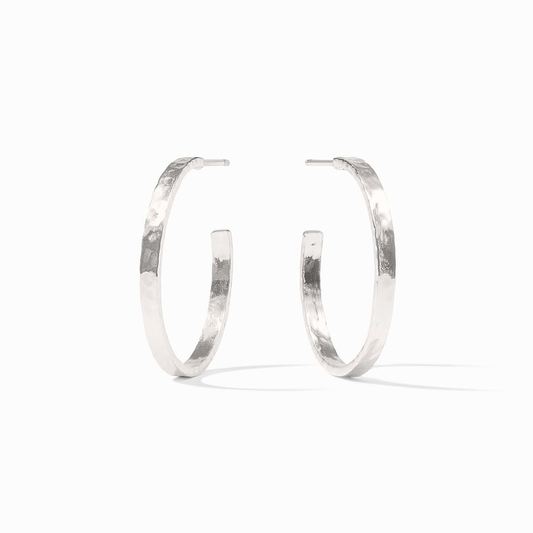 Lightly hammered silver hoop earring with pure silver plated backs.