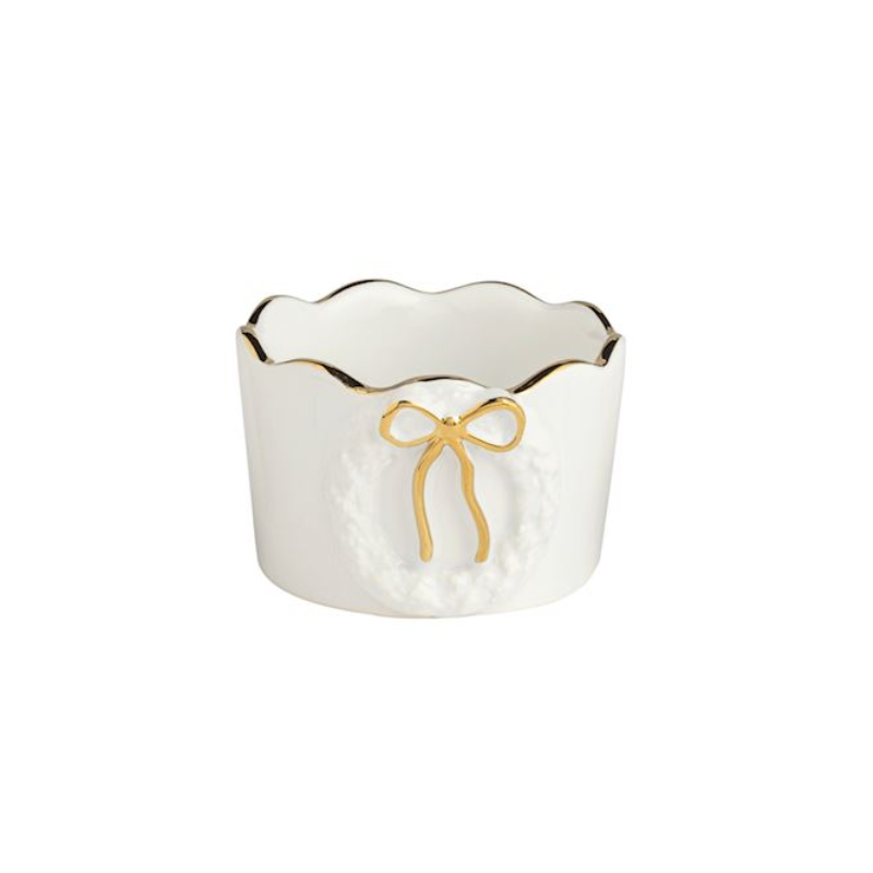 White stoneware tidbit dish with a scalloped gold edge and a raised wreath motif with a gold bow.
