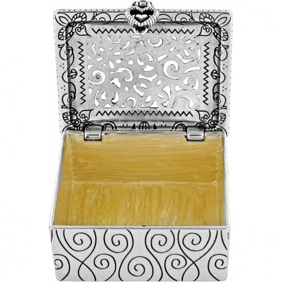 Open Lacie Daisy silver-plated jewel box with floral filigree lid and yellow enamel interior.
