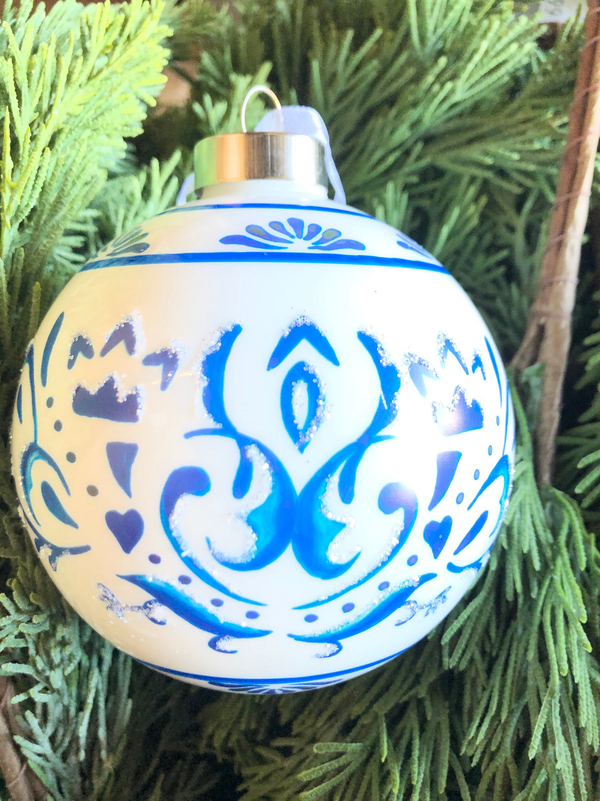 Blue scroll-patterned ball with white accents