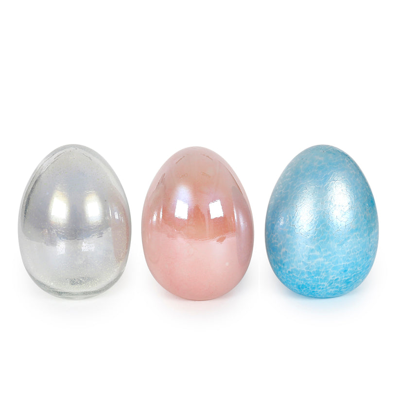 Five-point-five-inch white ceramic Easter egg with pastel floral patterns.