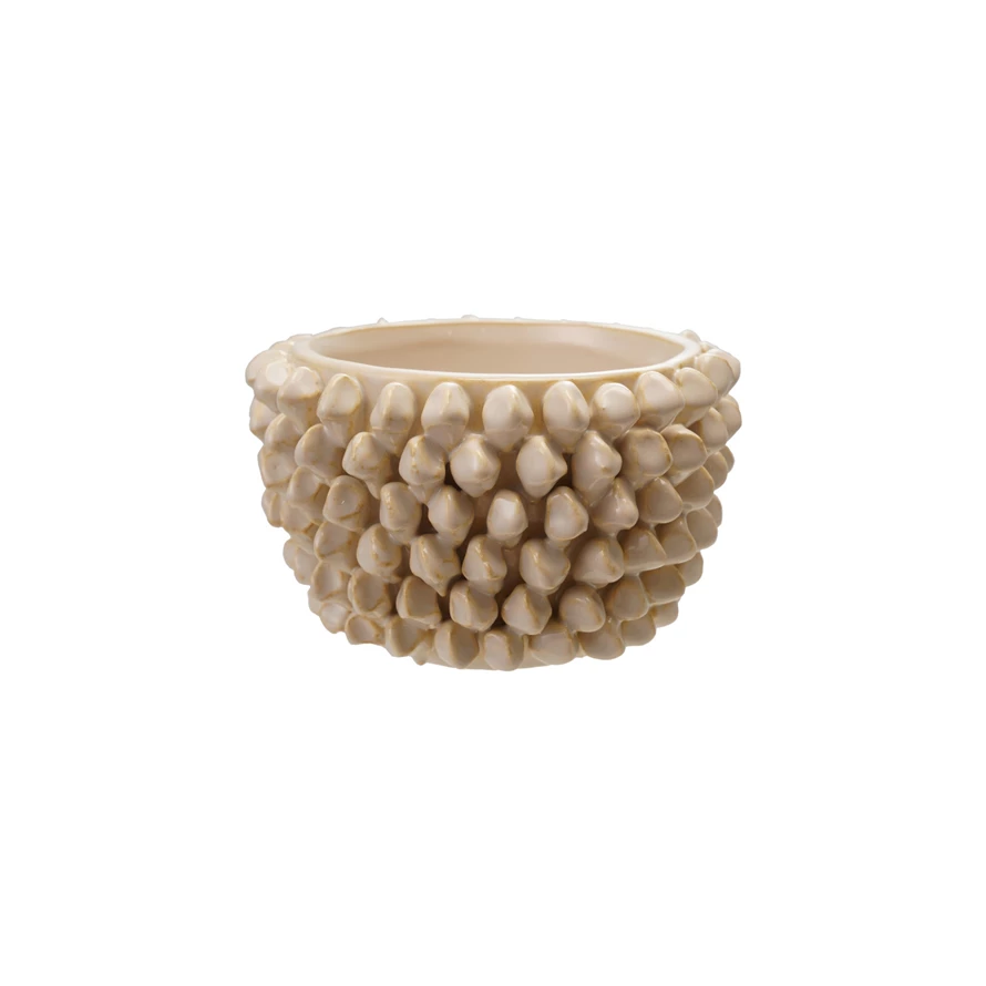 Round stoneware planter with a cube-shaped silhouette in natural earth tones.