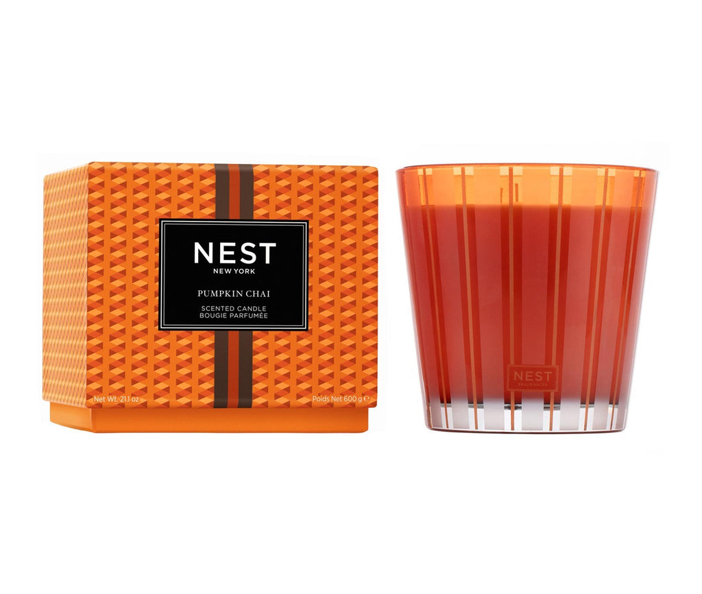 Nest 3-Wick candle in a clear glass jar with white wax.