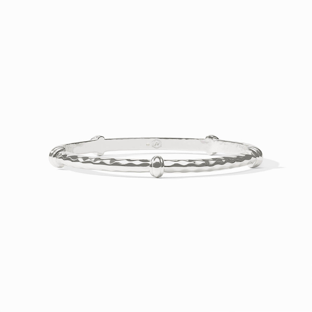 Silver Savannah Bangle with a hammered texture and smooth decorative accents.