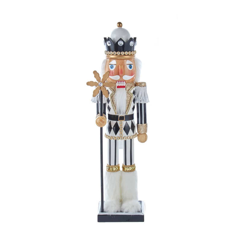 15-inch nutcracker in black, white, and gold with a snowflake staff and glitter accents.