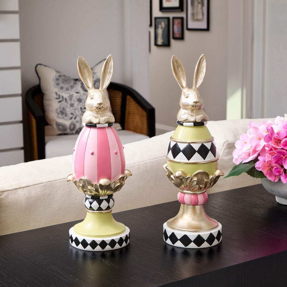 Resin garden bunny egg topiary with a white finish standing on a green base.