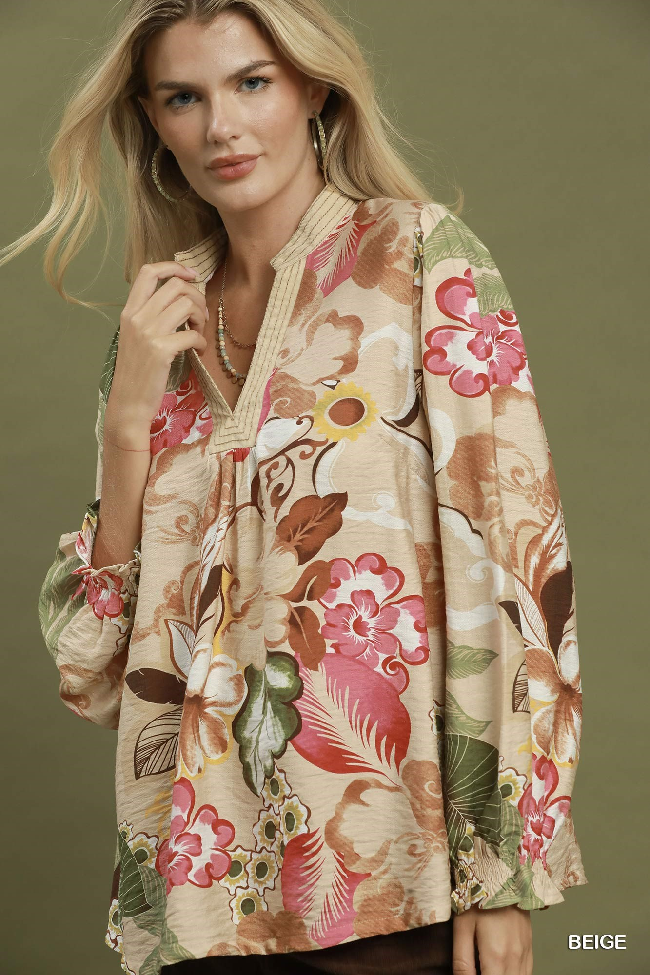 Mia Floral Print V-Neck Blouse in beige with pink and brown flowers and long puff sleeves.