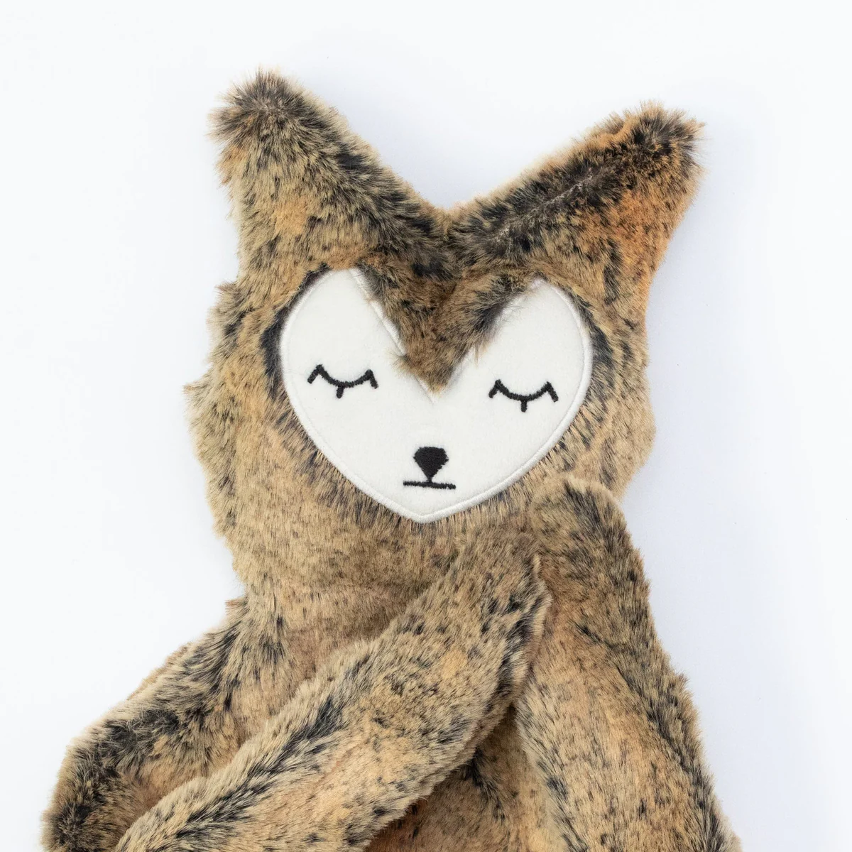Slumberkins Fox Snuggler plush toy with brown faux fur and a heart-shaped face with closed eyes.