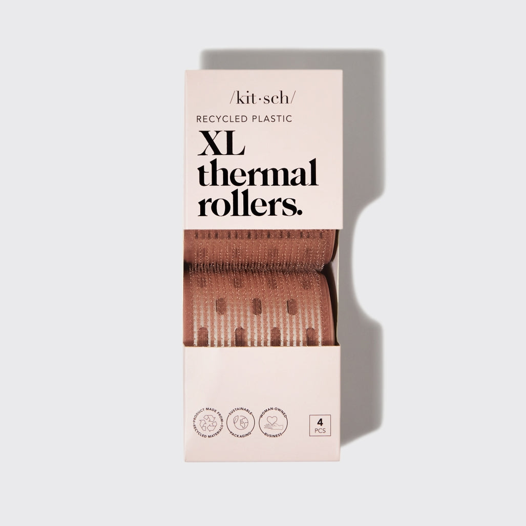 Four-piece set of XL ceramic thermal rollers with strong-grip recycled plastic handles in two sizes.