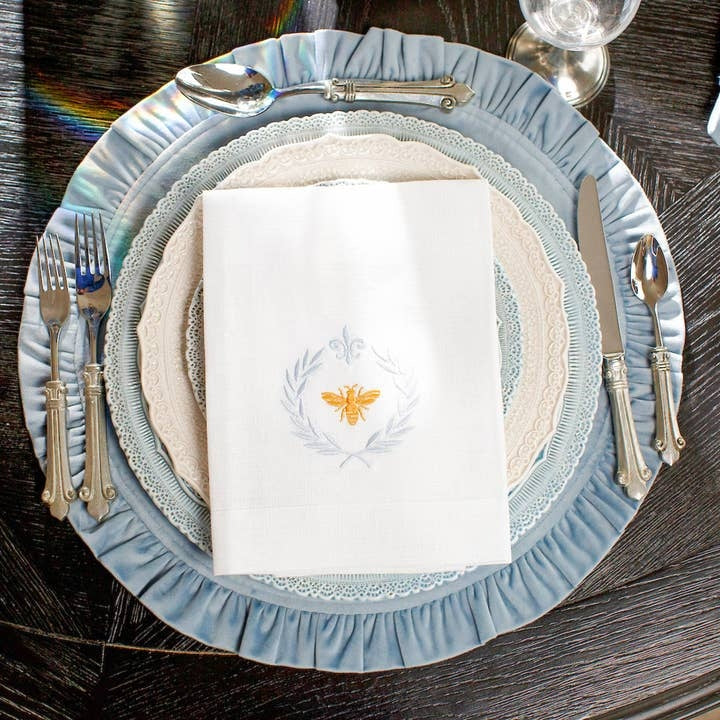 Round ruffle velvet placemat in a soft neutral tone with an 18-inch circular silhouette.