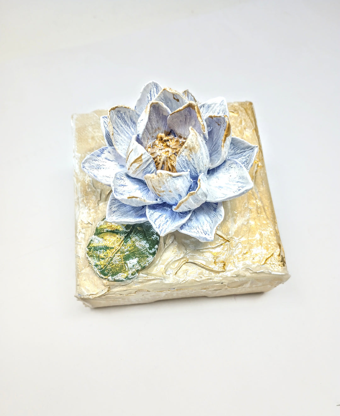 4x4 inch clay waterlily artwork sculpture in earthy tones with organic petal shape.