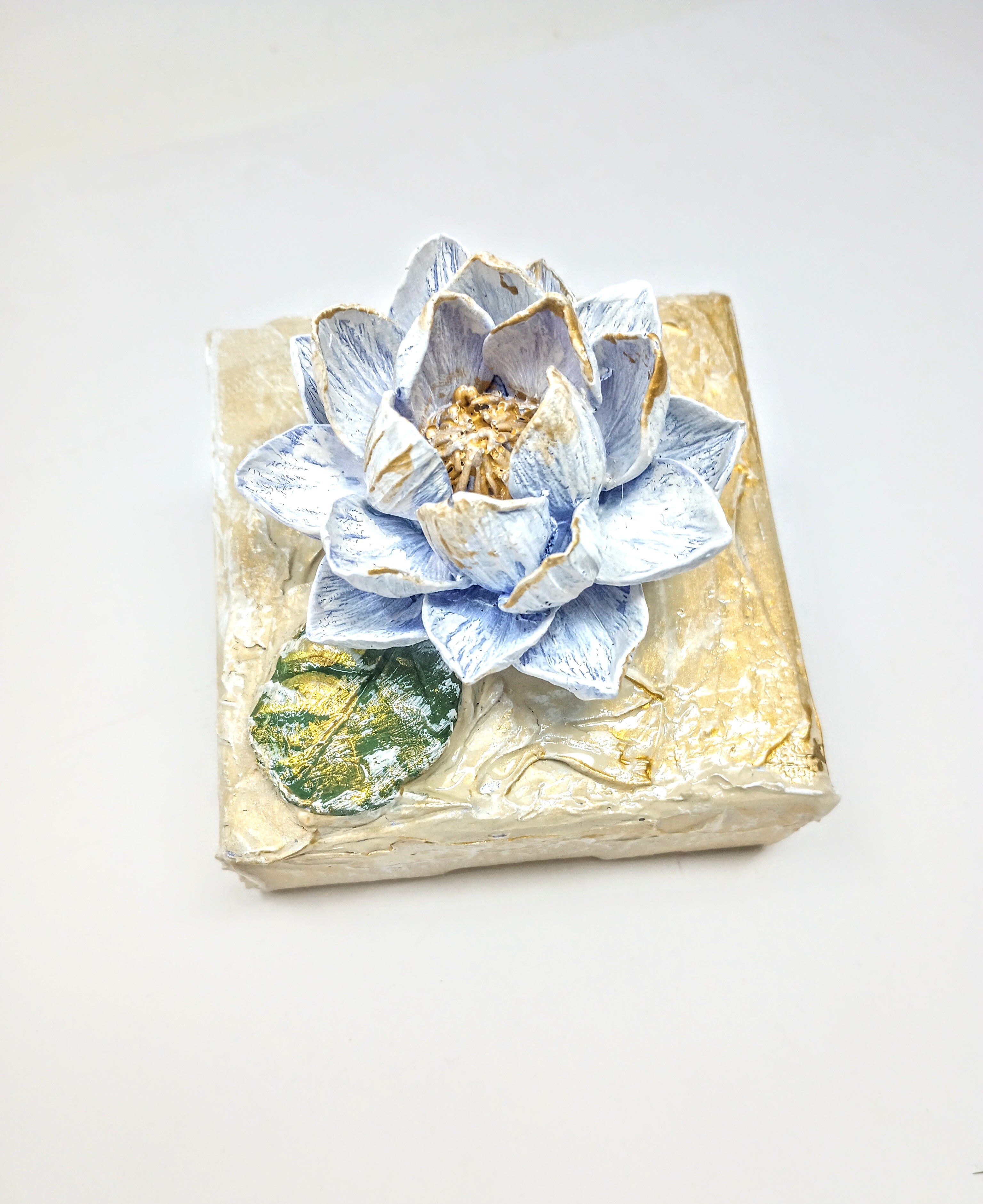 4x4 inch clay waterlily artwork sculpture in earthy tones with organic petal shape.