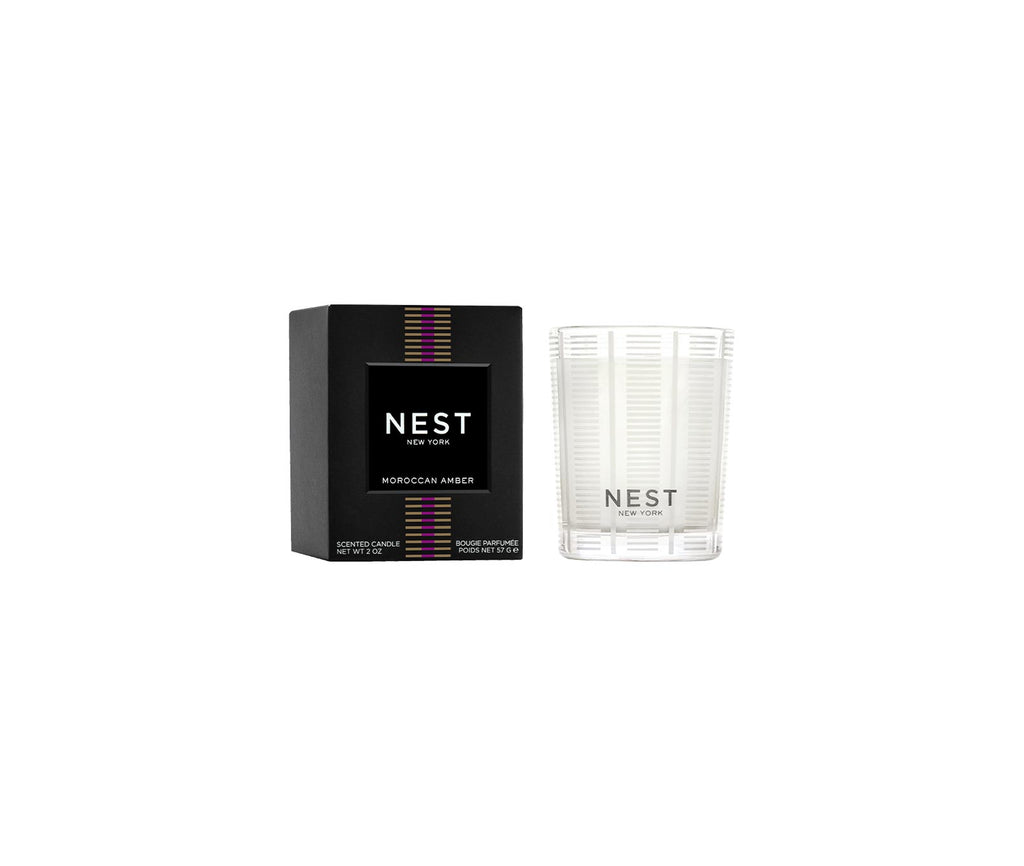 Nest Votive Candle in a clear glass holder with white wax.