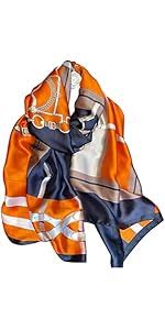 Reversible silk scarf featuring an orange, navy blue, and white equestrian-inspired pattern.
