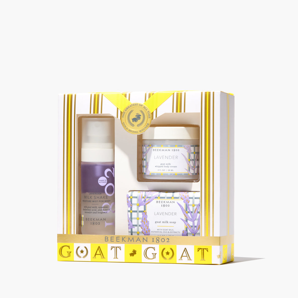 Lavender goat milk body care gift set with soap, whipped cream, and mist in travel sizes.