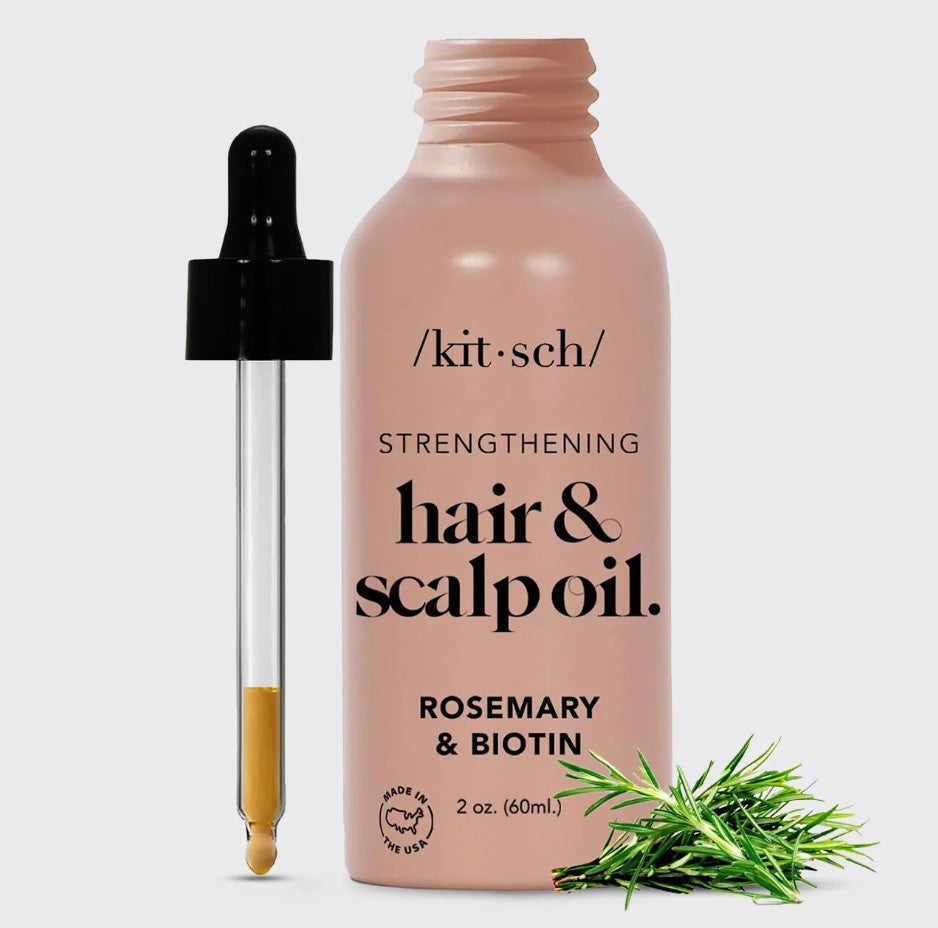 Bottle of Strengthening Hair & Scalp Oil with dropper against a neutral background.