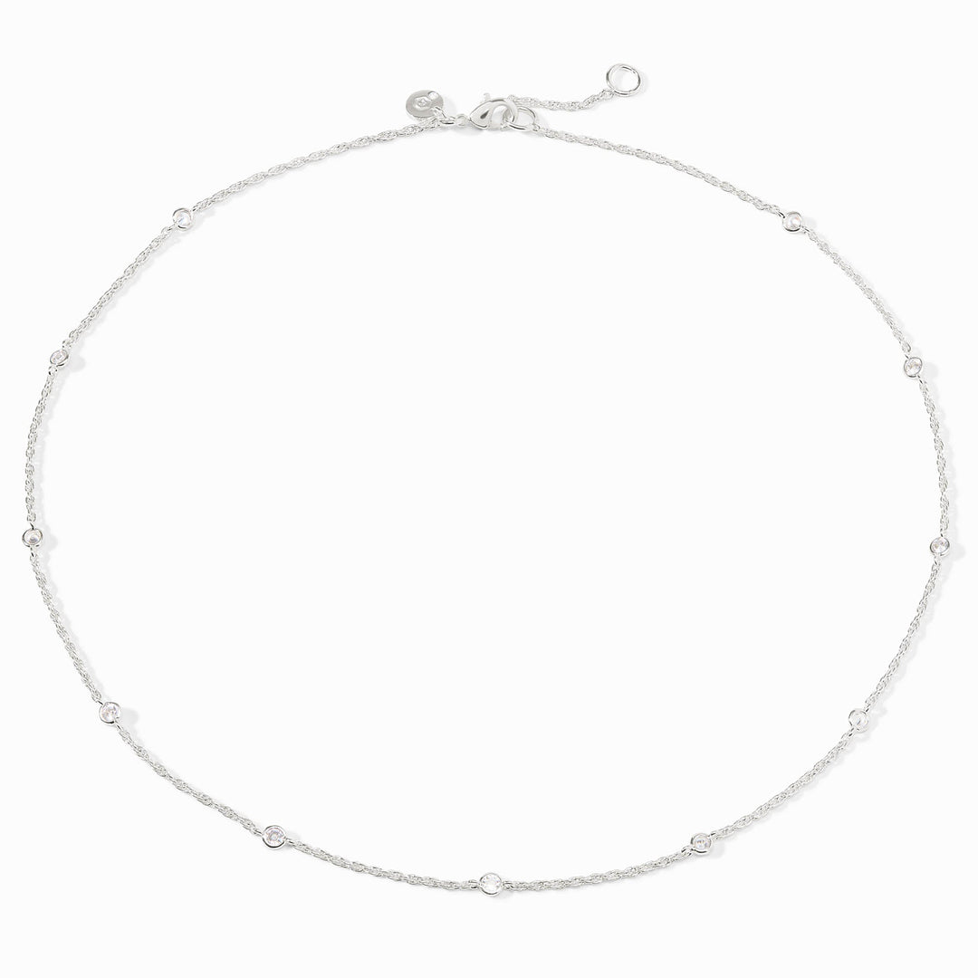 Silver station necklace with small round cubic zirconia stones and an adjustable lobster clasp.