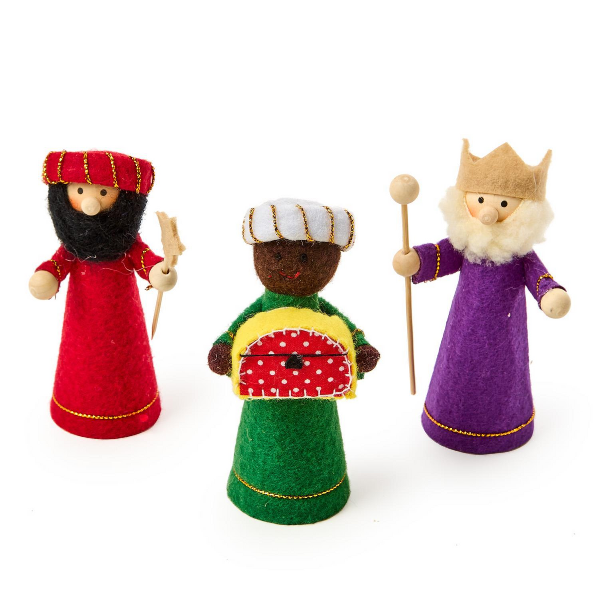 Three handcrafted felt Wise Men figurines from a nativity set in red, green, and purple robes.