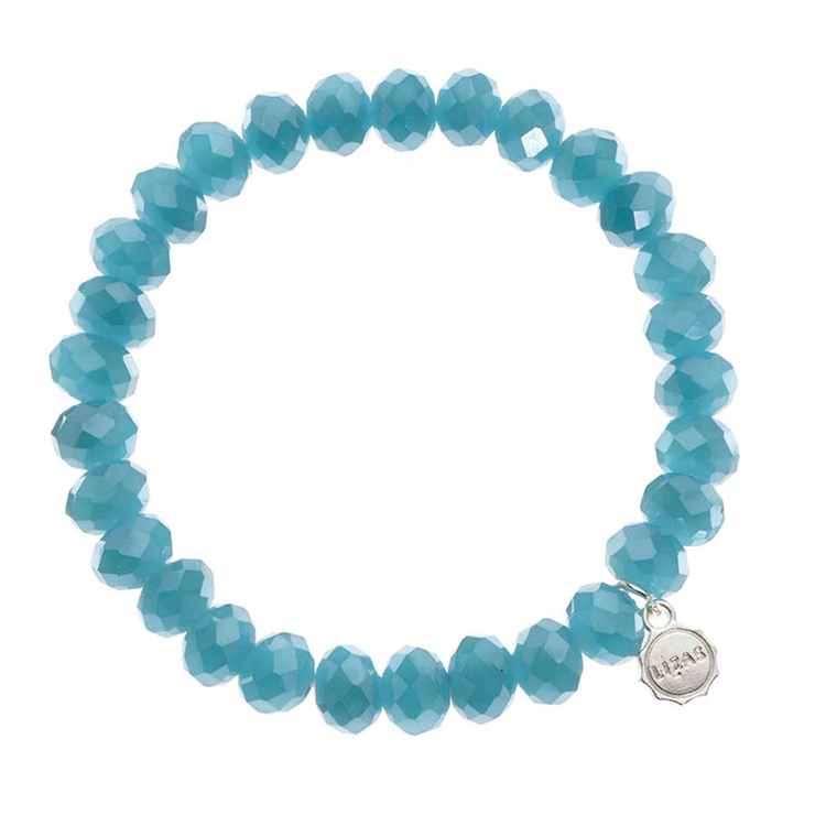 Lizas Quadro Big Bright Colours stretch bracelet with faceted turquoise crystal beads and logo charm