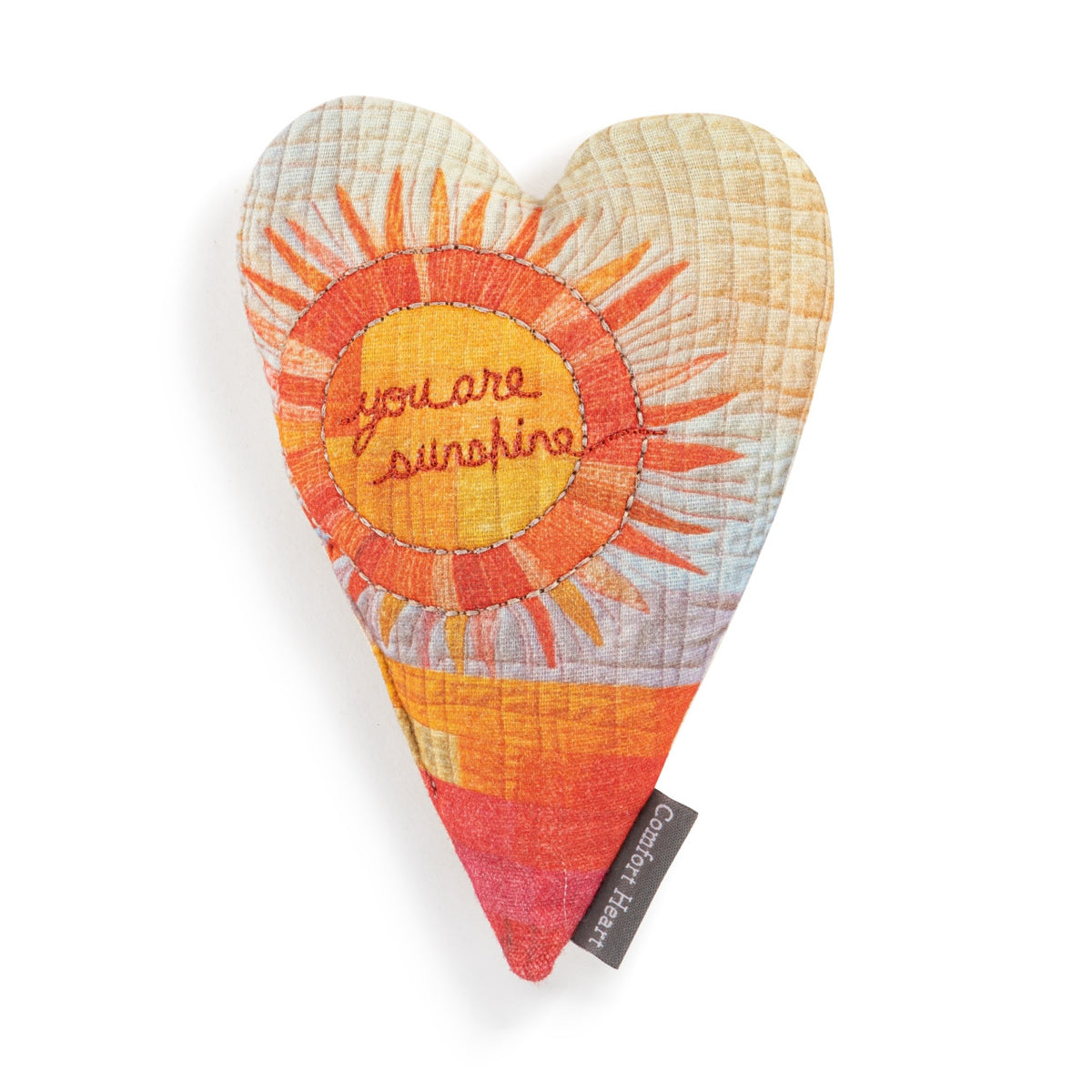 Comfort Heart plush toy with a heart-shaped body made of cotton fabric filled with polyester fiberfill and beads.