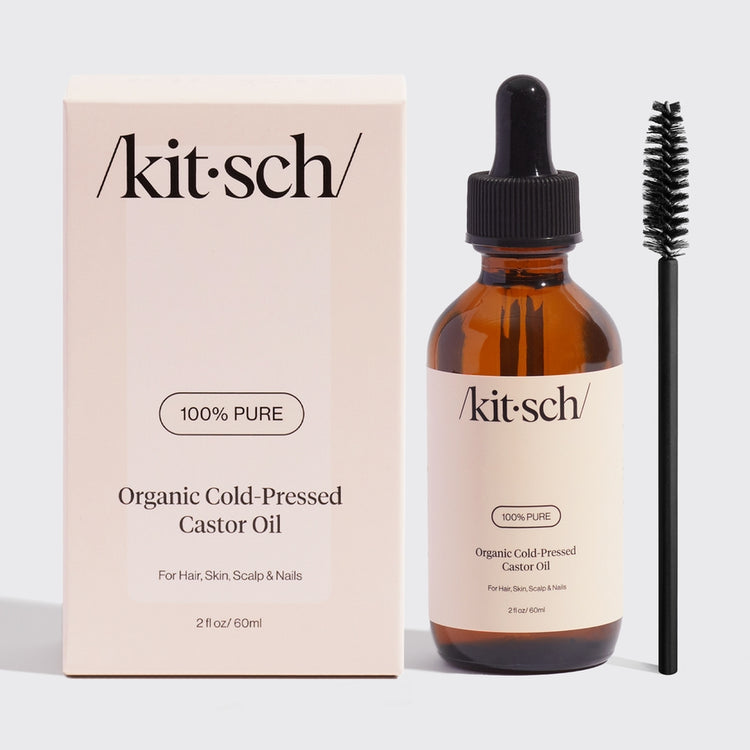 Bottle of USDA organic castor oil with a white label against a neutral background.