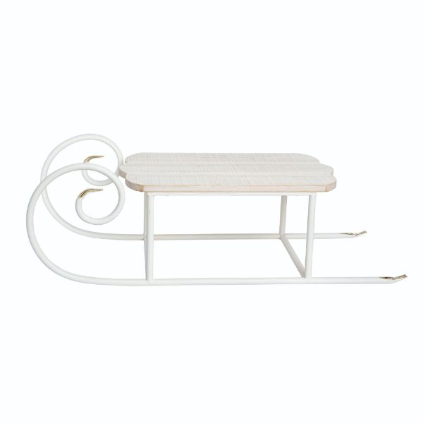 White metal sled decor with gold-tipped runners and a light wood plank seat.