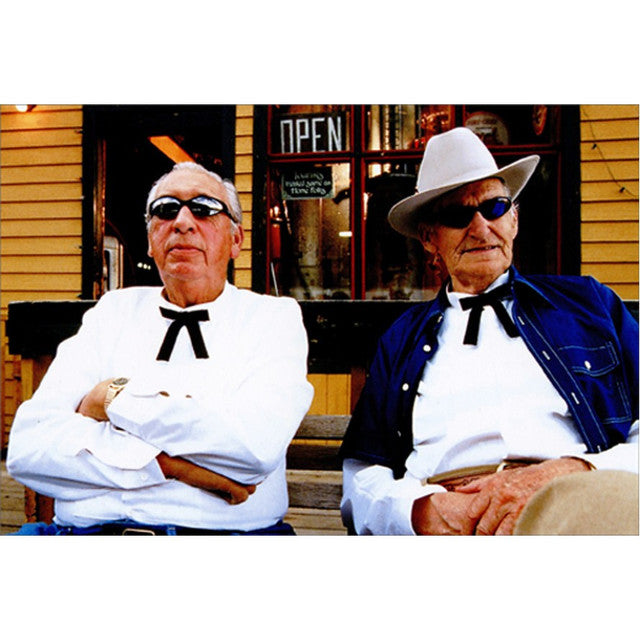 Black-framed men's glasses with a 'Happy Birthday' message on the lens