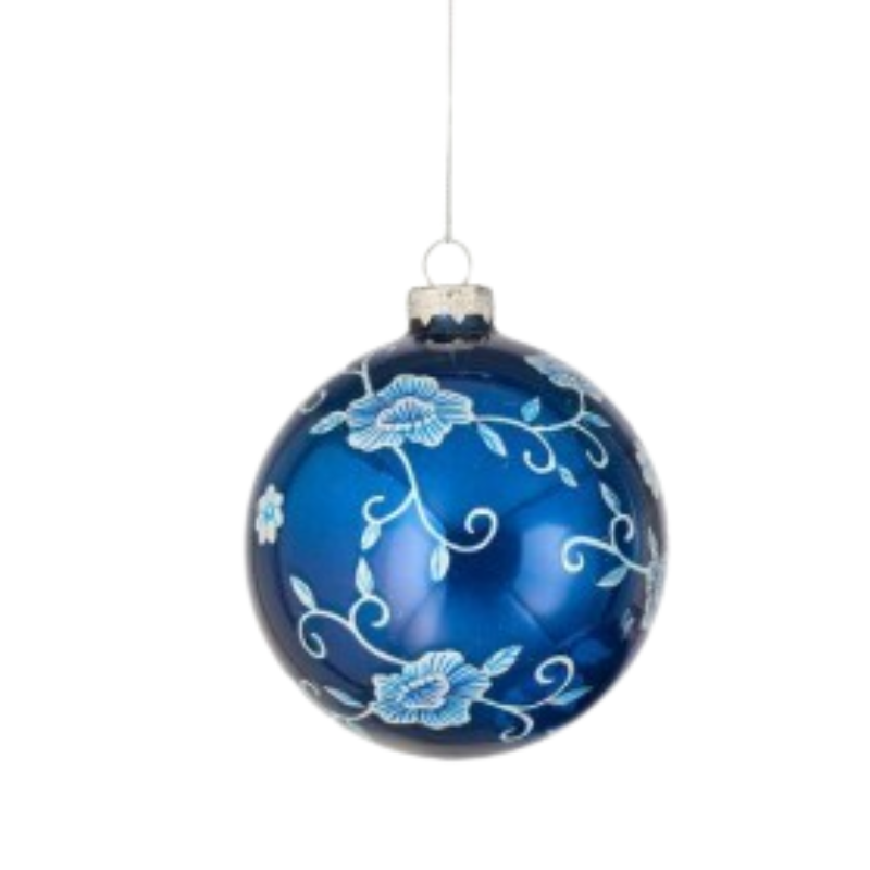 Blue glass ball ornament with white and light blue floral patterns and silver hanging loop.