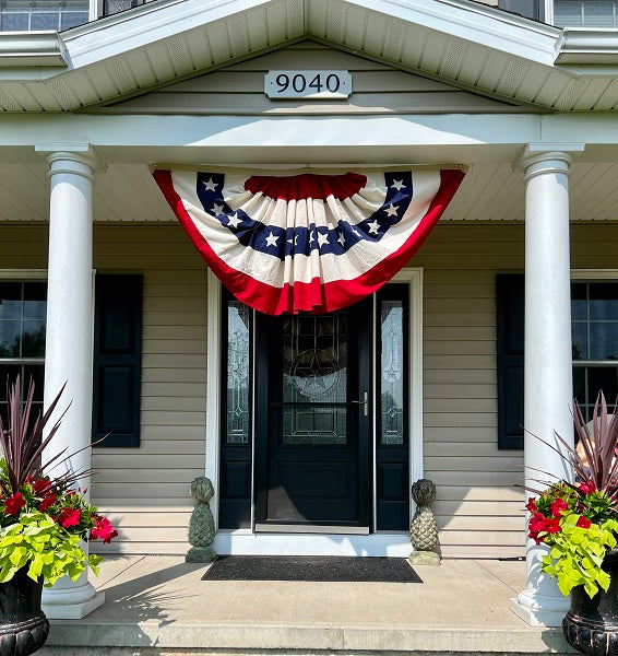 Vintage flag bunting banner with red, white, and blue stars on a natural fabric background.