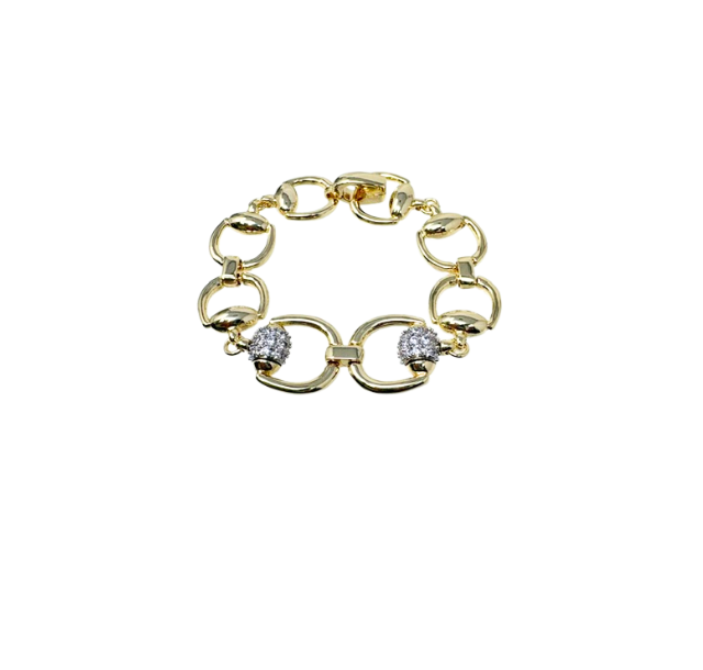 Gold-tone horsebit link bracelet featuring two pave-set crystal accents on the front links.