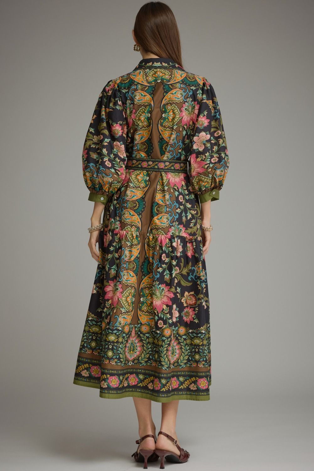 Back view of a woman wearing a Chloe printed midi dress with balloon sleeves and a floral pattern.