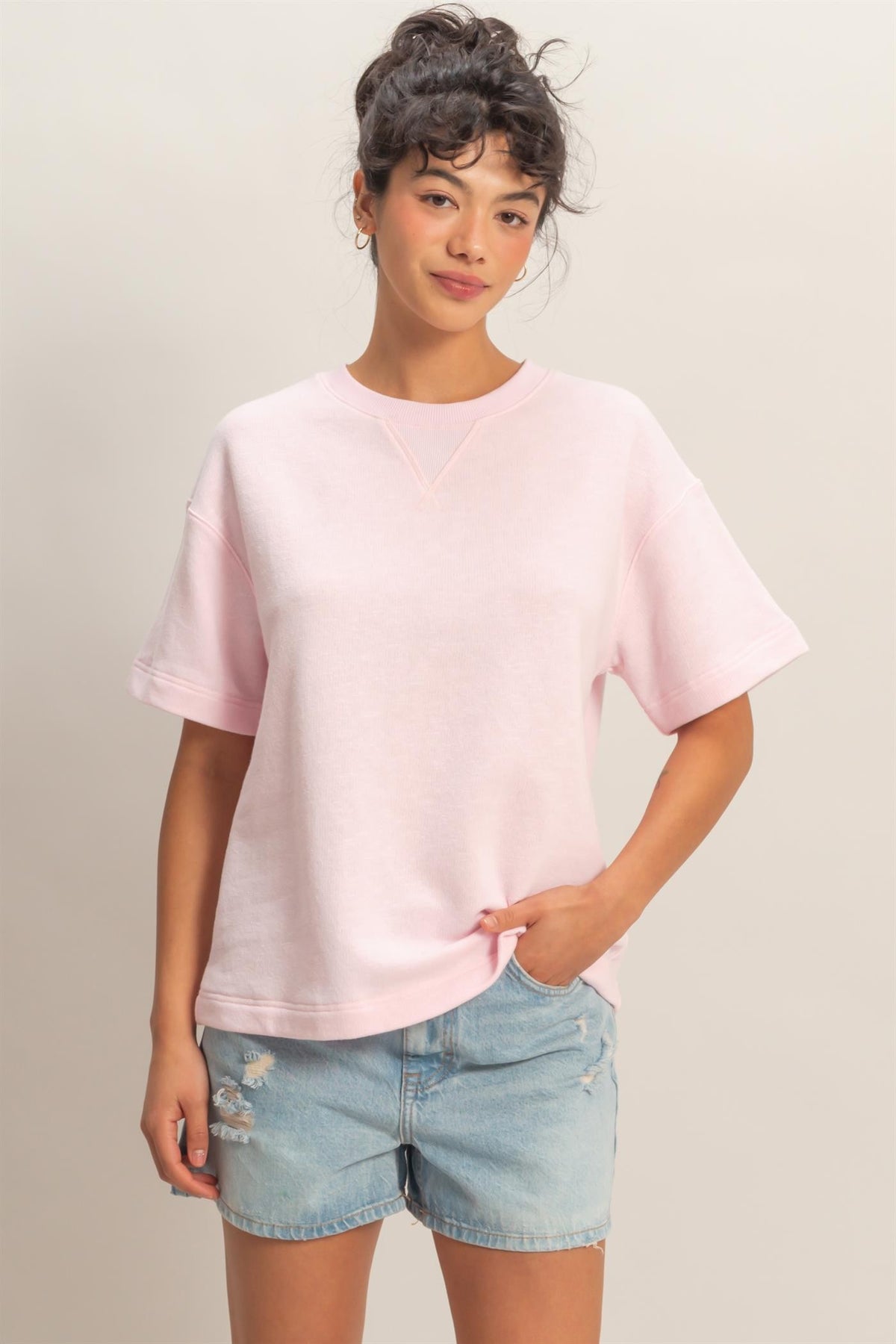 Airine crew neck short sleeve top in solid color made from cotton polyester blend fabric.