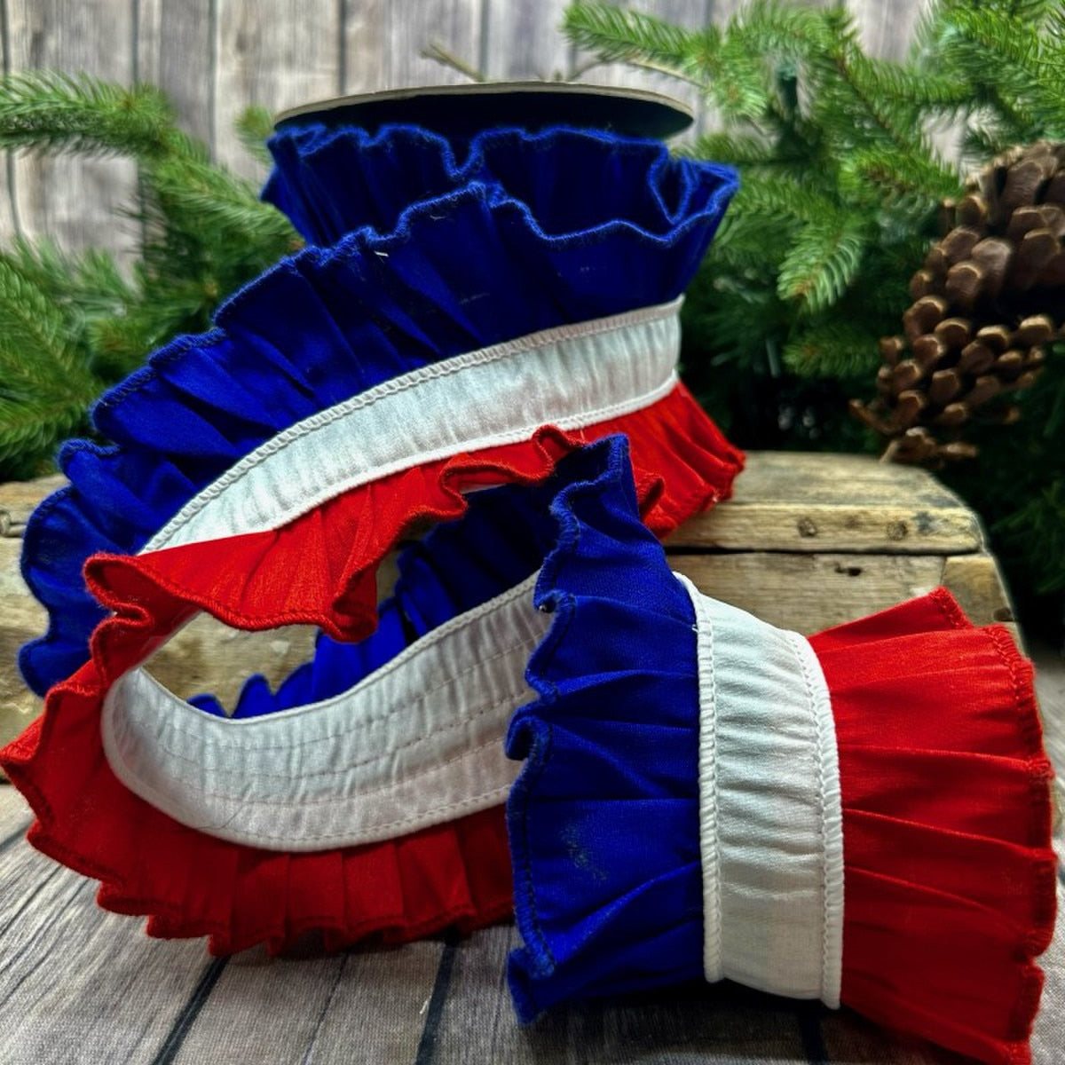 Red Dupion silk ruffle trim with royal blue ribbon accents