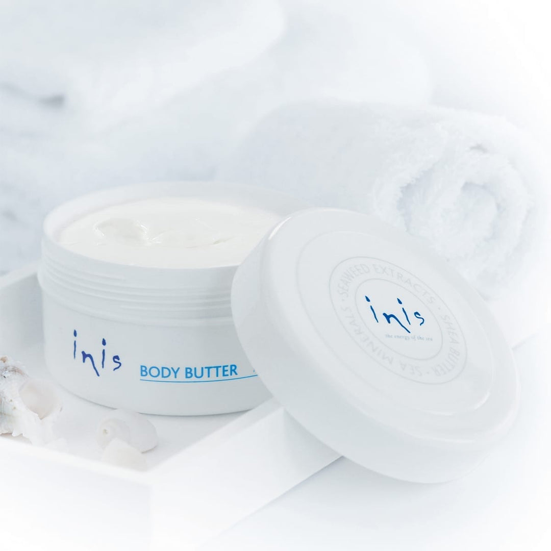 Inis Rejuvenating Body Butter in a white tub with seaweed extract ingredients.