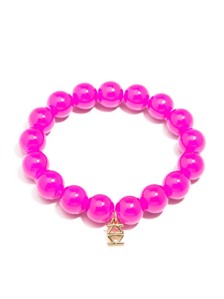 Stretch bracelet with glossy lucite glass beads in a neutral tone.