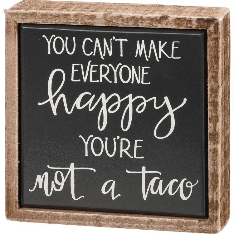 Black box sign with white text that reads "You can't make everyone happy. You're not a taco."