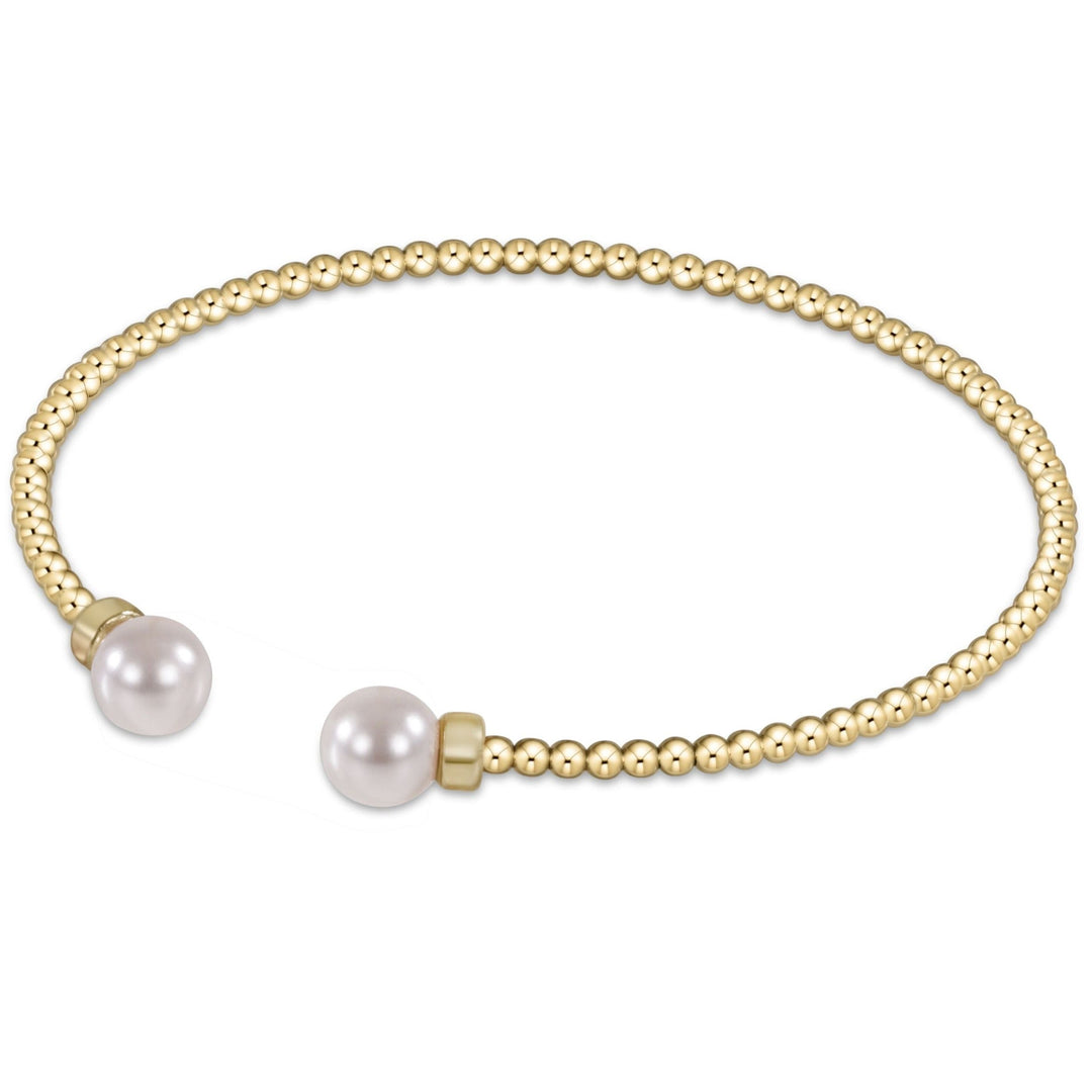 Classic gold 2mm bead cuff bracelet featuring two white pearls at the open ends.