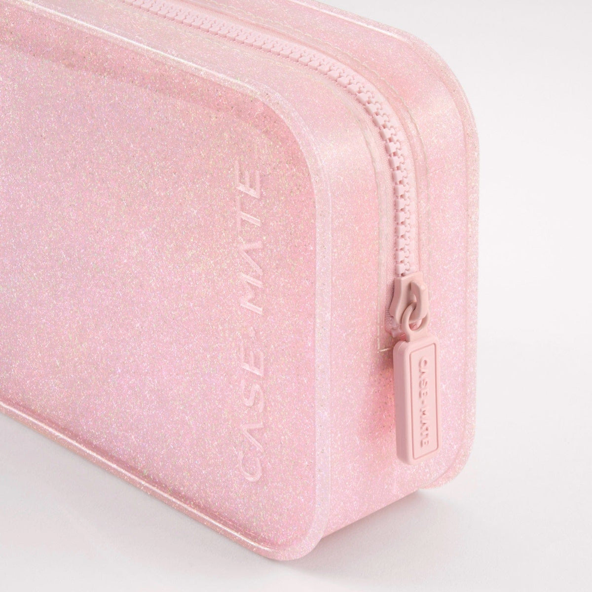 Close-up of a pink glitter jelly makeup bag with a zip closure and Case-Mate logo.