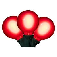 Three glowing red round LED filament glass bulbs on a dark green stringer.
