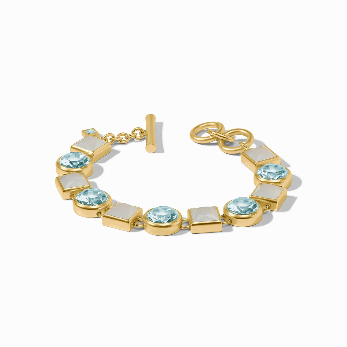 Adjustable Jolie tennis bracelet in gold-plated metal with a toggle clasp and clear glass stones.