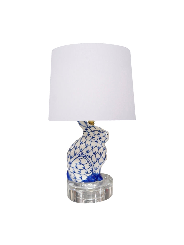 Hand-painted blue and white porcelain bunny lamp with a retro drum off-white shade on a crystal base.
