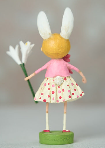 Polyresin Easter Lily figurine with white petals and green stem.