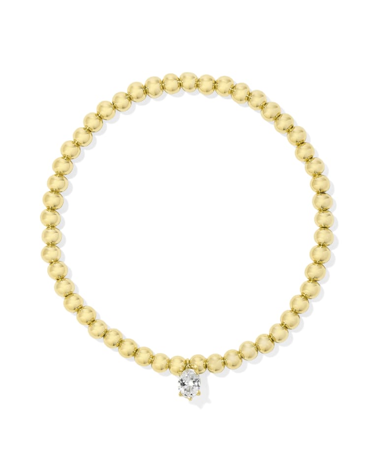 White CZ stretch bracelet with dainty crystal charm on yellow gold over brass