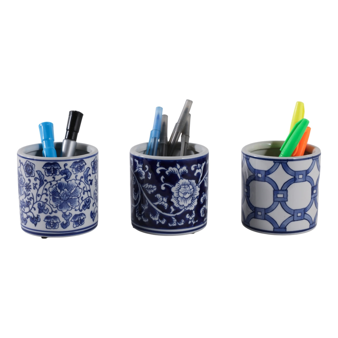 Three blue and white ceramic chinoiserie pencil cups with floral and geometric patterns.