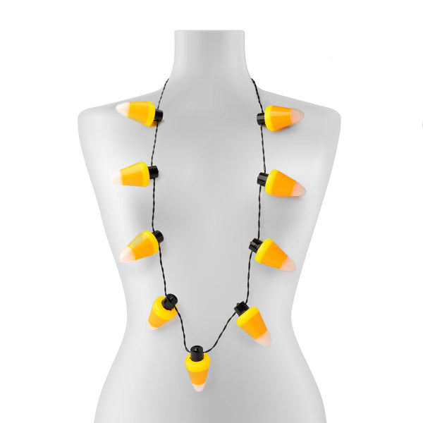 Jumbo candy corn flashing Halloween necklace with 9 LEDs on a white mannequin torso.