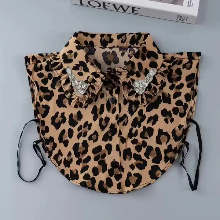 Leopard print detachable shirt collar with ruffled edges and diamond-studded embellishments.
