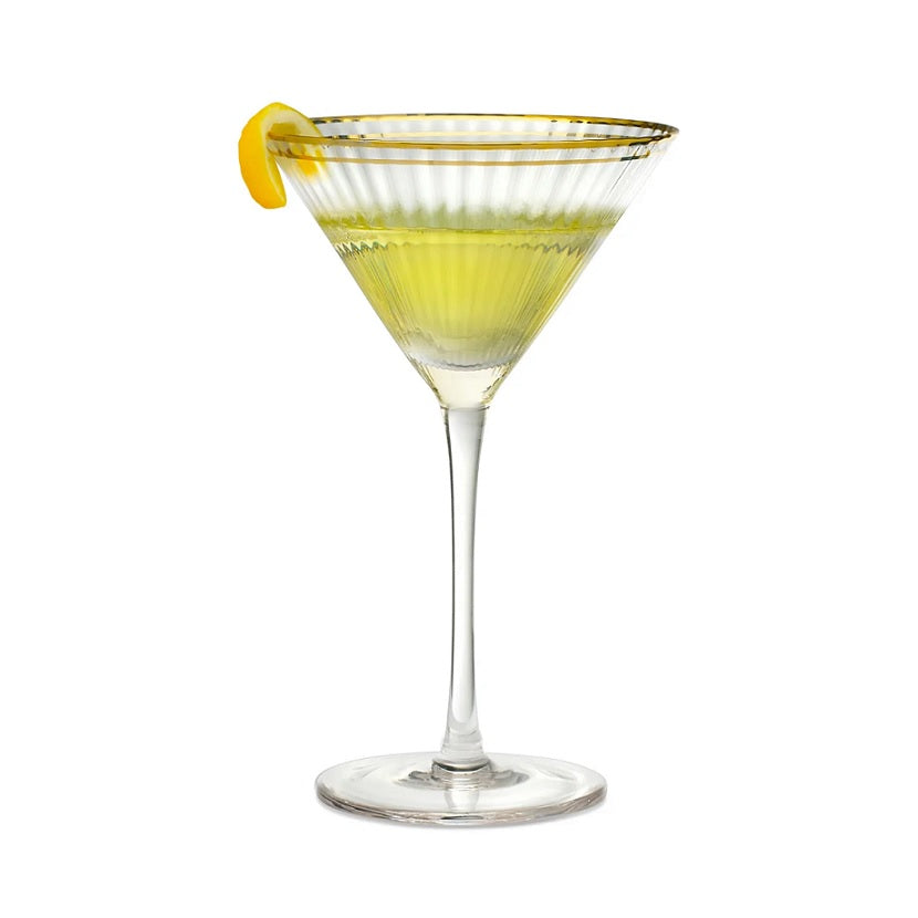Qualia Rocher Martini Glass with gold rim, ribbed texture, and a lemon twist garnish.